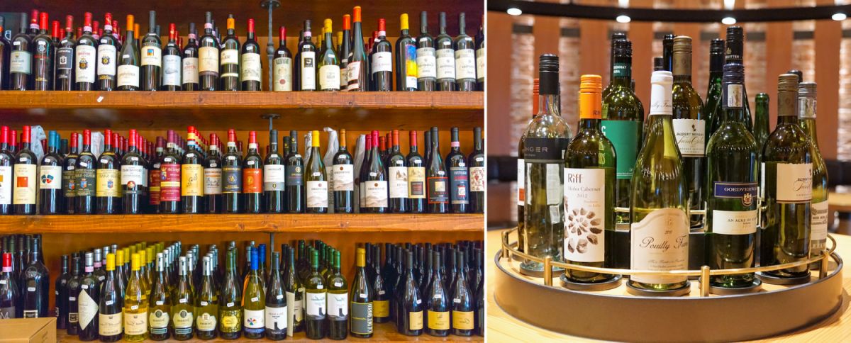 Weinhandel - Regal mit Weinflaschen / Plateau mit Weinflaschen